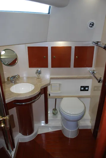 No Name Yacht Photos Pics Fairline Squadron 2000 yacht bathroom with modern fixtures and wooden accents.