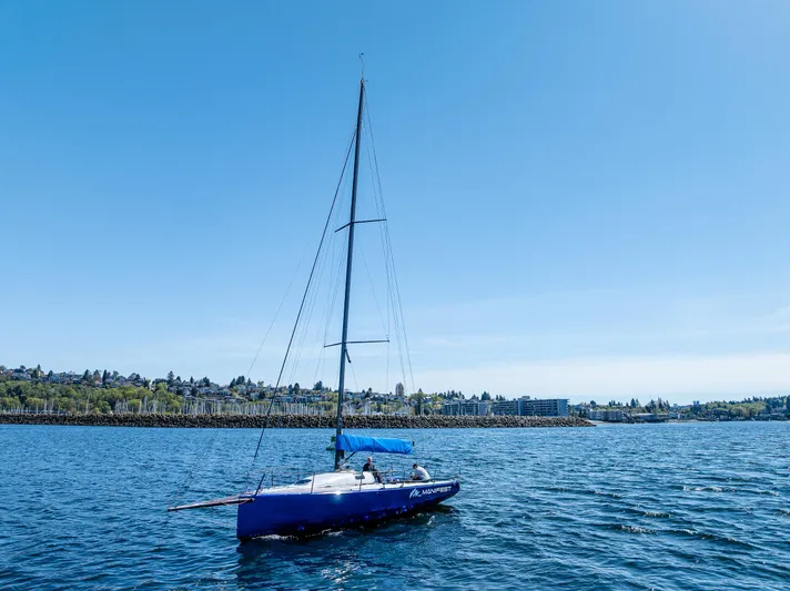 Manifest Yacht Photos Pics Sailing boat "Offshore Racing" Van Munster Boats Fred Barrett 35, 2016, on calm blue water.