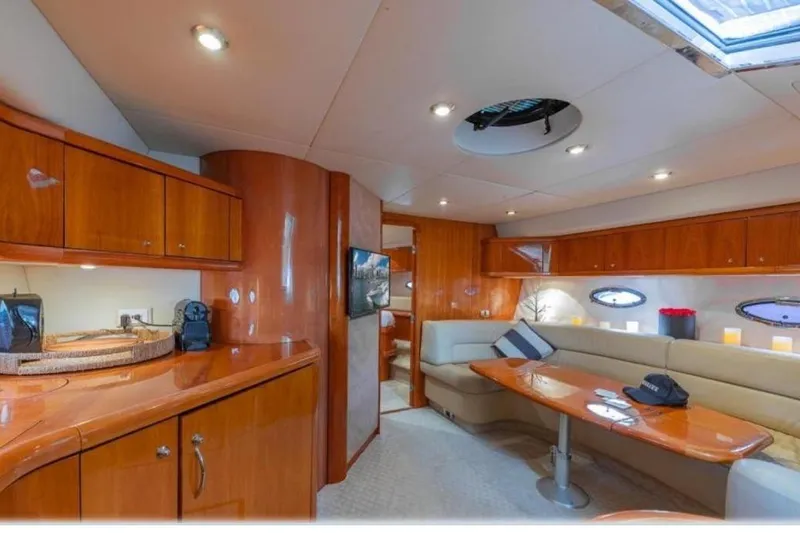  Yacht Photos Pics Luxurious interior of 2006 Sunseeker Portofino 47 yacht with elegant wood finishes.