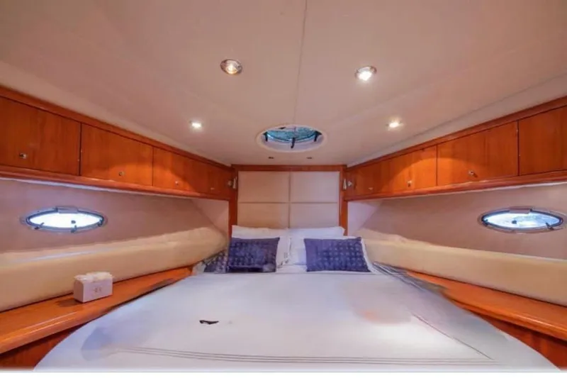  Yacht Photos Pics Luxurious cabin interior of 2006 Sunseeker Portofino 47 yacht with cozy bedding.