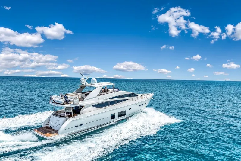 Princess Y85 Yacht Photos Pics Luxury Princess 85 yacht cruising on open sea under clear blue sky.