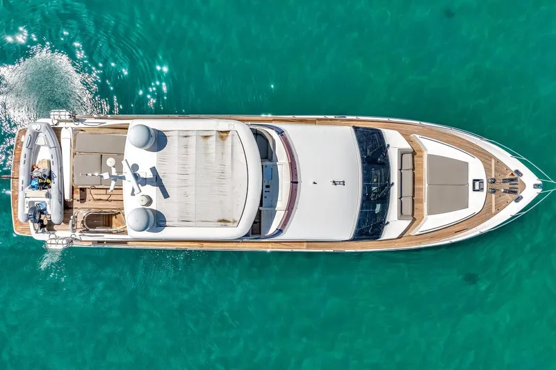 Princess Y85 Yacht Photos Pics Top view of 2012 Princess 85 yacht on clear turquoise water.