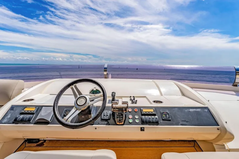 Princess Y85 Yacht Photos Pics Helm of 2012 Princess 85 yacht with ocean view and blue sky.