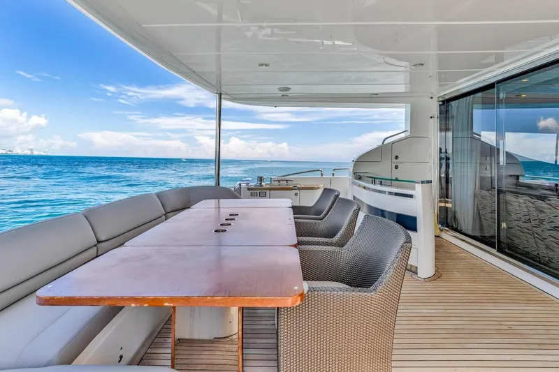 Princess Y85 Yacht Photos Pics Luxurious 2012 Princess 85 yacht deck with ocean view, featuring elegant seating and dining area.