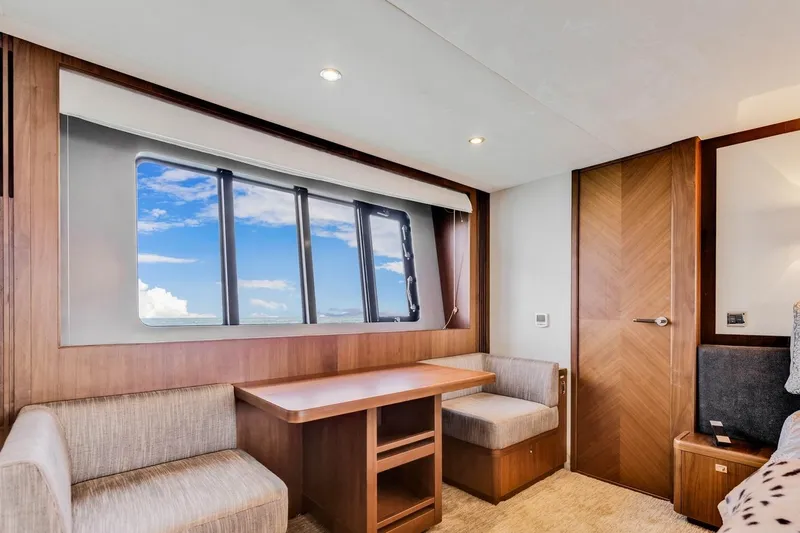 Princess Y85 Yacht Photos Pics Luxurious interior of a 2012 Princess 85 yacht with elegant wood finishes and seating.