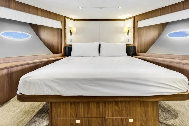 Princess Y85 Yacht Photos Pics Luxurious cabin interior of 2012 Princess 85 yacht with elegant wood finish.