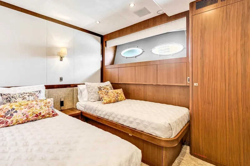 Princess Y85 Yacht Photos Pics Luxurious cabin interior of 2012 Princess 85 yacht with twin beds and elegant wood paneling.