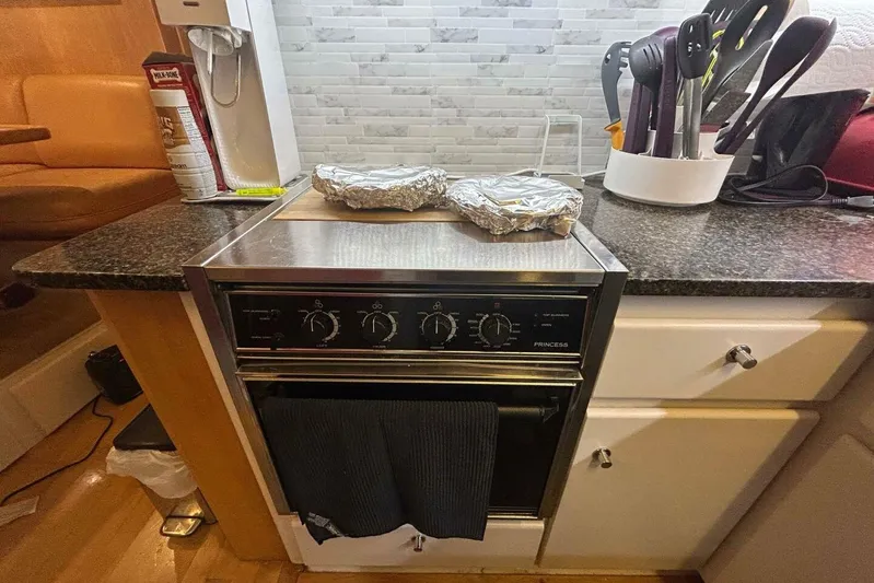 Contentment Yacht Photos Pics Compact kitchen area in a 1995 Carver 440 Aft Cabin Motor Yacht.