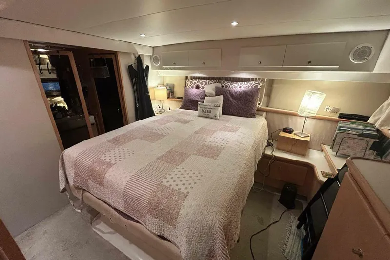 Contentment Yacht Photos Pics Cozy bedroom in 1995 Carver 440 Aft Cabin Motor Yacht with elegant decor.