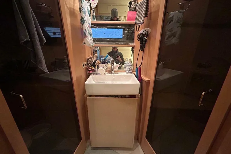 Contentment Yacht Photos Pics Bathroom interior of 1995 Carver 440 Aft Cabin Motor Yacht with sink and mirror.