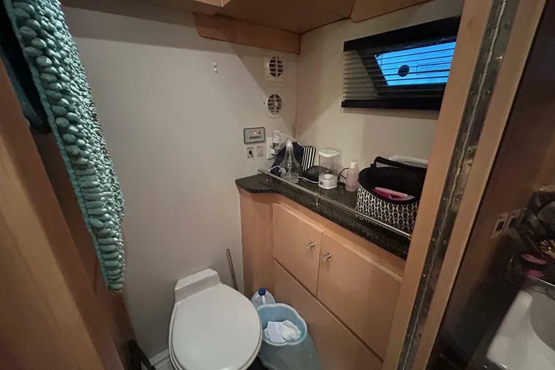 Contentment Yacht Photos Pics Bathroom interior of 1995 Carver 440 Aft Cabin Motor Yacht with modern amenities.