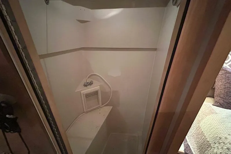 Contentment Yacht Photos Pics Shower area in 1995 Carver 440 Aft Cabin Motor Yacht, featuring compact design.