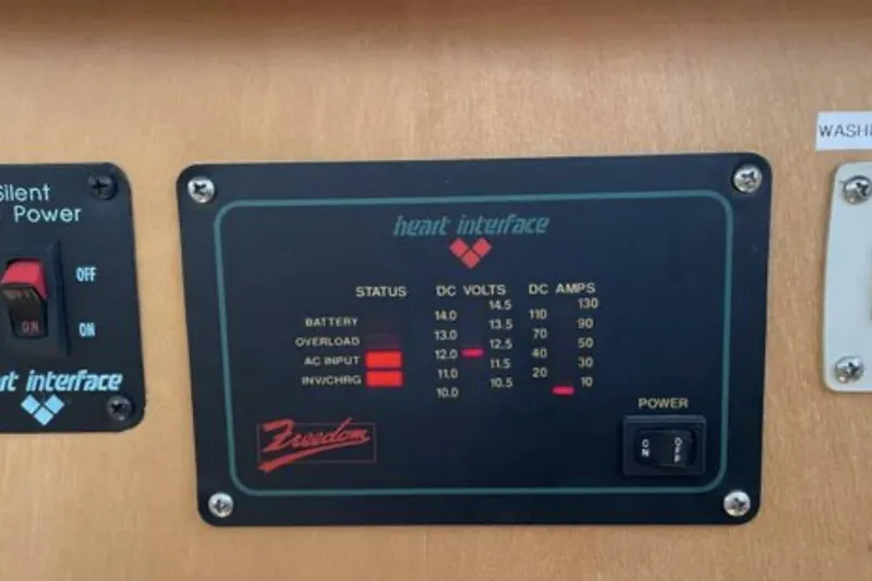 Contentment Yacht Photos Pics Control panel on 1995 Carver 440 Aft Cabin Motor Yacht, displaying voltage and amperage.