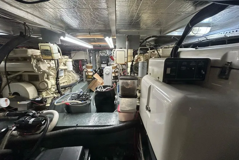 Contentment Yacht Photos Pics Engine room of a 1995 Carver 440 Aft Cabin Motor Yacht, showcasing machinery and equipment.