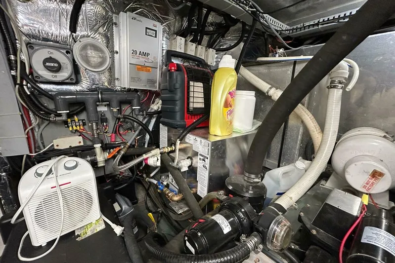 Contentment Yacht Photos Pics Engine room of a 1995 Carver 440 Aft Cabin Motor Yacht with various equipment and wiring.