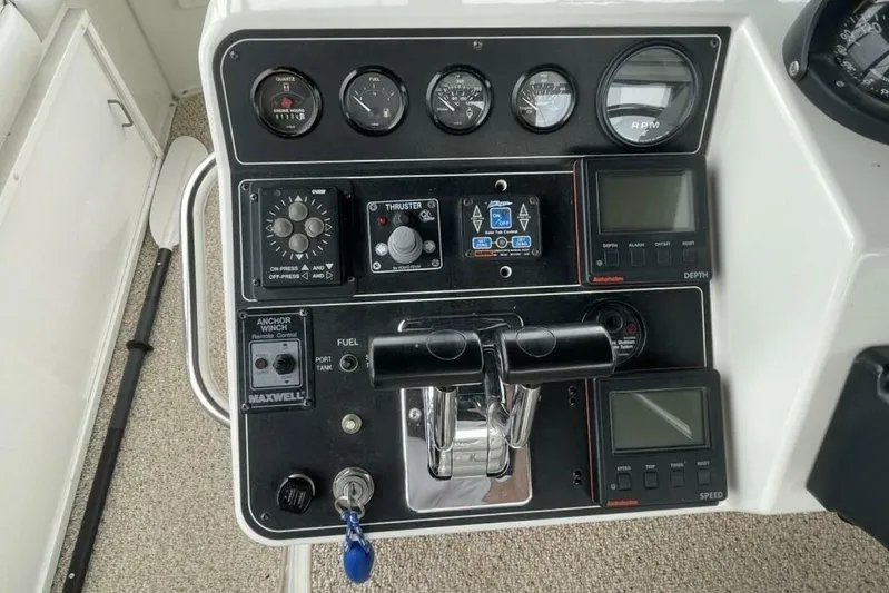 Contentment Yacht Photos Pics Control panel of a 1995 Carver 440 Aft Cabin Motor Yacht with gauges and switches.