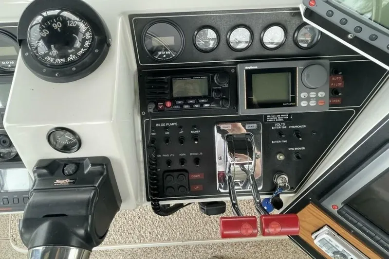 Contentment Yacht Photos Pics Control panel of a 1995 Carver 440 Aft Cabin Motor Yacht with navigation instruments.
