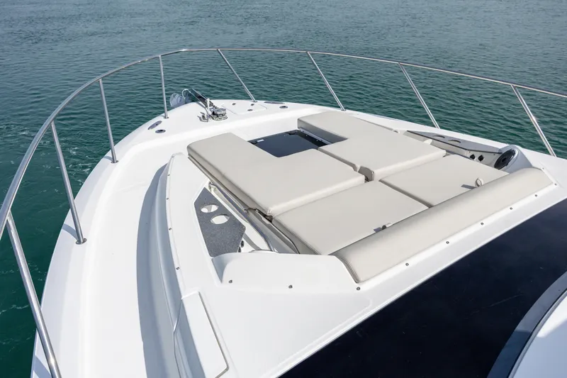 New Trade-in- All Offers & Trades Welcome Yacht Photos Pics Boston Whaler 405 Conquest 2021 boat deck with cushioned seating on calm water.