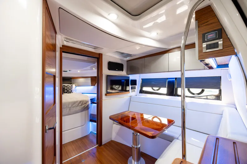 New Trade-in- All Offers & Trades Welcome Yacht Photos Pics Luxurious interior of 2021 Boston Whaler 405 Conquest yacht with modern furnishings.