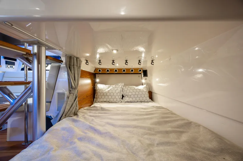 New Trade-in- All Offers & Trades Welcome Yacht Photos Pics Cozy cabin interior of 2021 Boston Whaler 405 Conquest with bed and modern lighting.