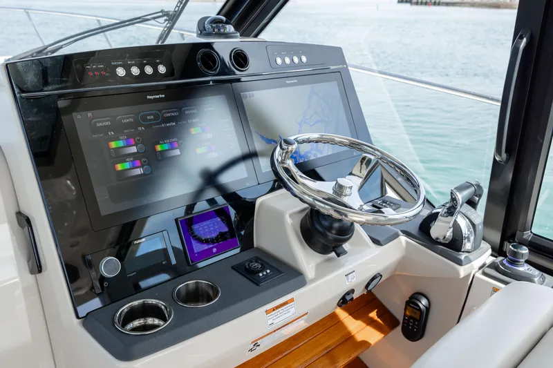 New Trade-in- All Offers & Trades Welcome Yacht Photos Pics 2021 Boston Whaler 405 Conquest helm with modern controls and displays.