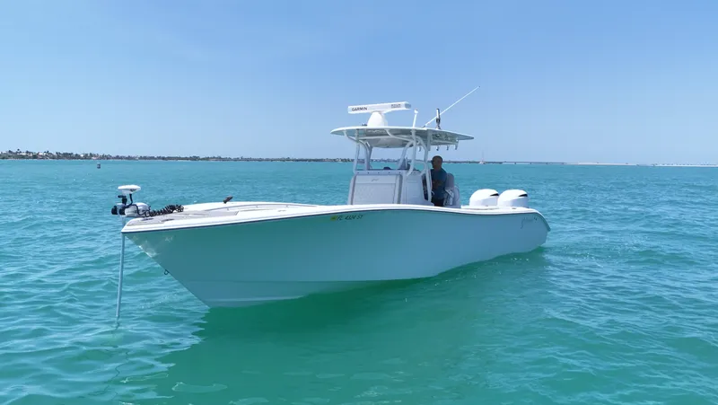 Yacht Photos Pics 2016 Yellowfin 32 Offshore boat on clear blue water under a sunny sky.