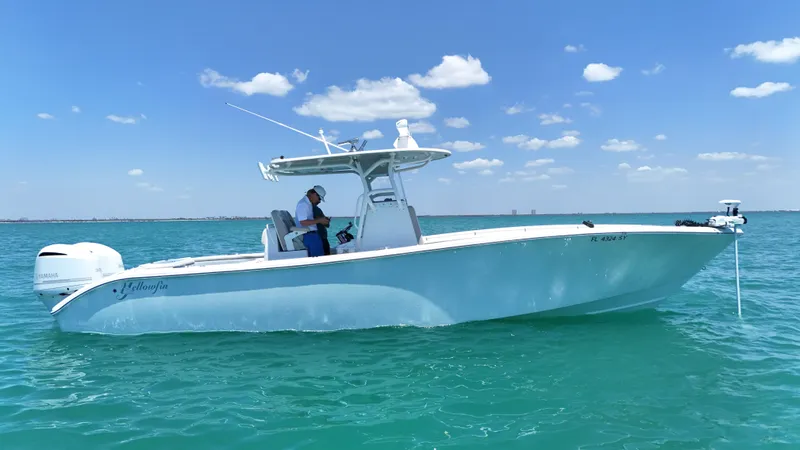  Yacht Photos Pics 2016 Yellowfin 32 Offshore boat on clear blue water under a sunny sky.