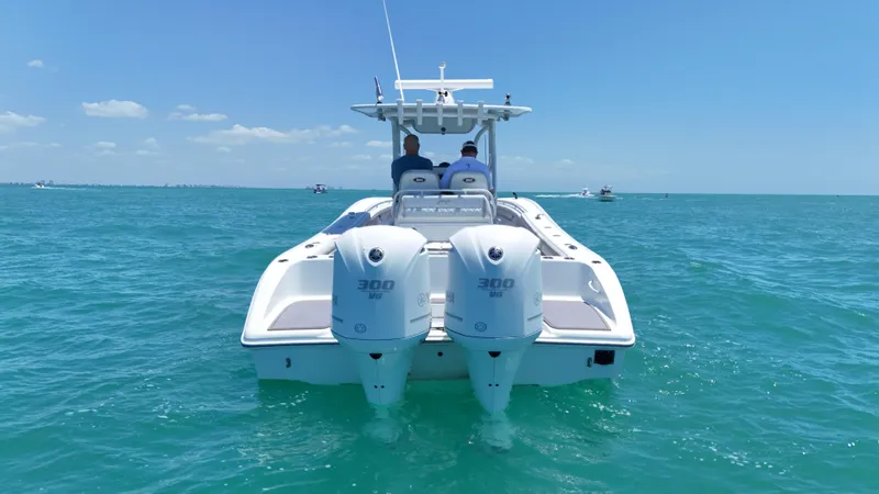  Yacht Photos Pics 2016 Yellowfin 32 Offshore boat with dual engines on open sea.
