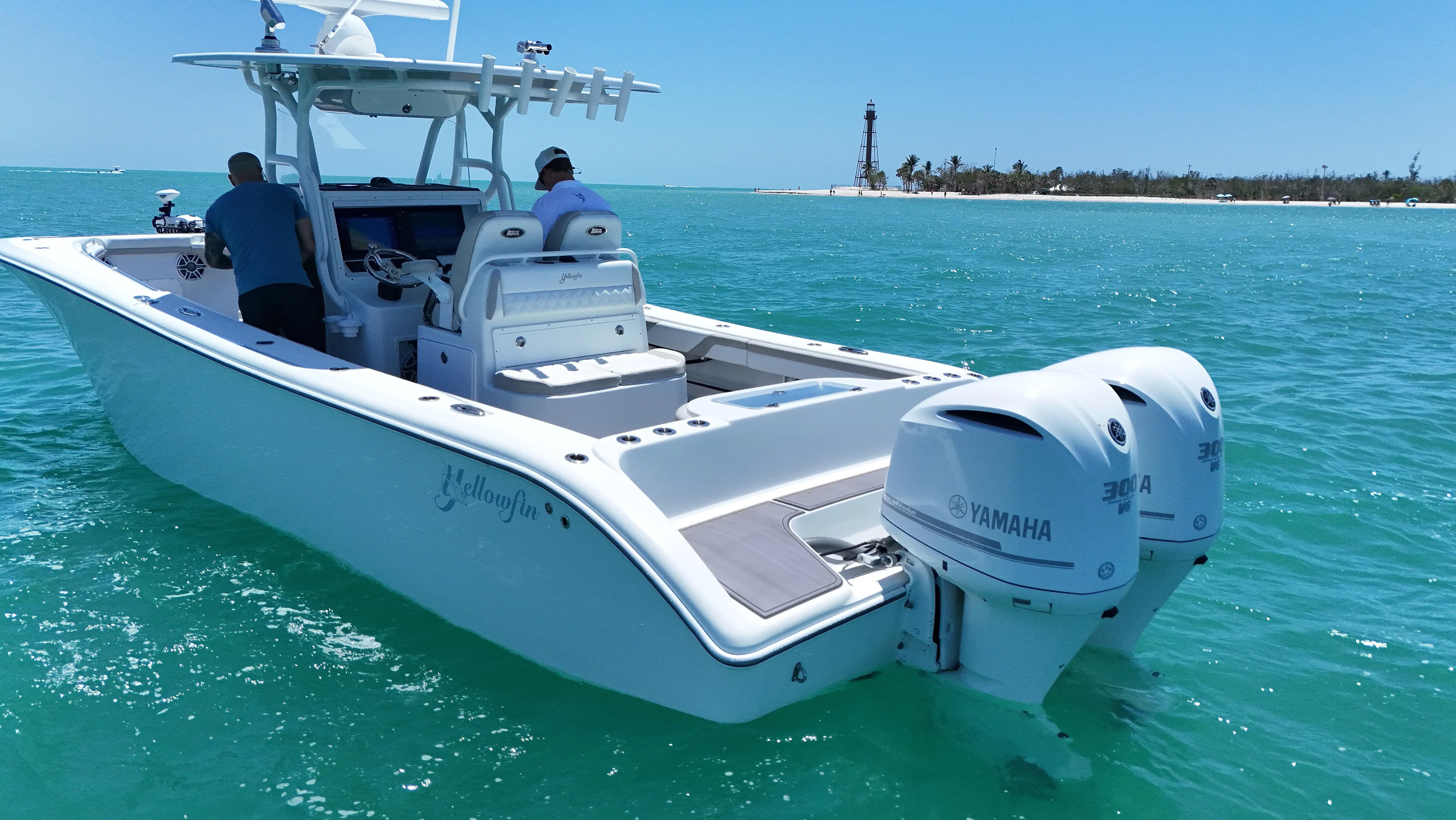  Yacht Photos Pics 2016 Yellowfin 32 Offshore boat with twin Yamaha engines on turquoise water.