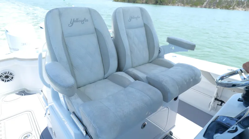  Yacht Photos Pics 2016 Yellowfin 32 Offshore boat seats with plush upholstery on a sunny day.