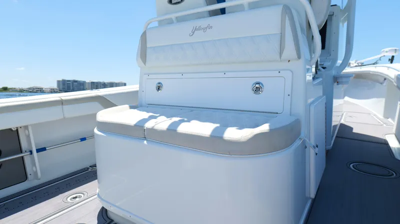  Yacht Photos Pics 2016 Yellowfin 32 Offshore boat interior with cushioned seating and storage.