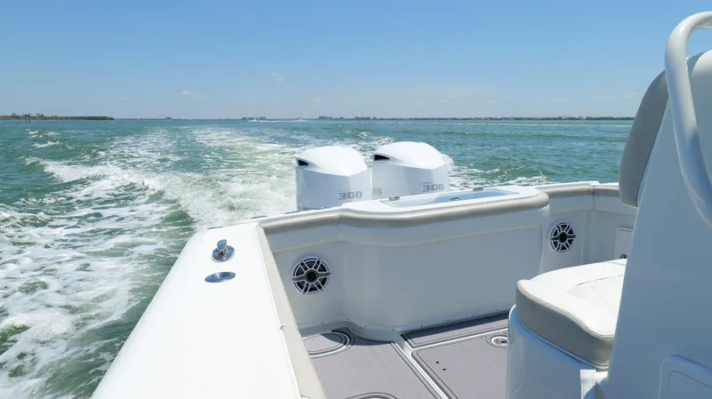  Yacht Photos Pics 2016 Yellowfin 32 Offshore boat cruising on open water, twin engines visible.