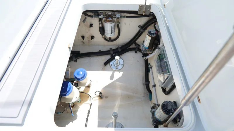  Yacht Photos Pics 2016 Yellowfin 32 Offshore boat compartment with visible wiring and components.
