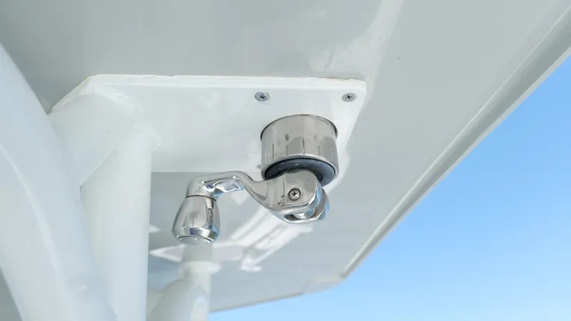  Yacht Photos Pics Close-up of a 2016 Yellowfin 32 Offshore boat component against a clear blue sky.