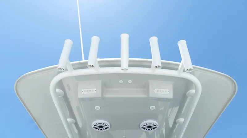  Yacht Photos Pics 2016 Yellowfin 32 Offshore boat top view with rod holders against clear blue sky.