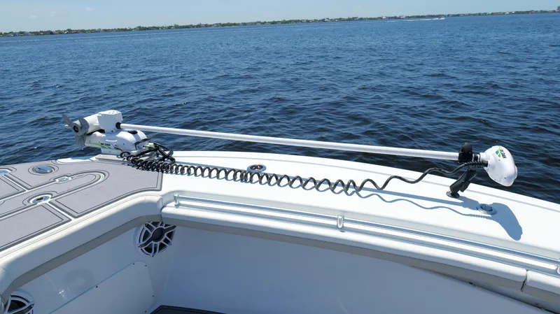  Yacht Photos Pics 2016 Yellowfin 32 Offshore boat with trolling motor on calm water.