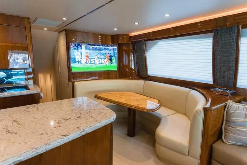 C Student Yacht Photos Pics Luxurious interior of 2017 Viking 66 Convertible yacht with plush seating and TV.