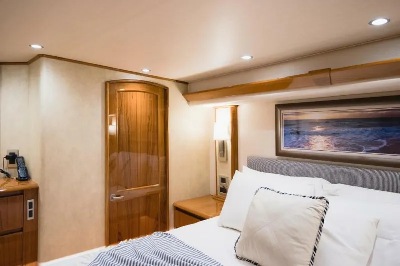 C Student Yacht Photos Pics Luxurious cabin interior of 2017 Viking 66 Convertible yacht with elegant wood finishes.