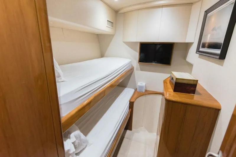 C Student Yacht Photos Pics Cozy cabin with bunk beds in 2017 Viking 66 Convertible yacht.