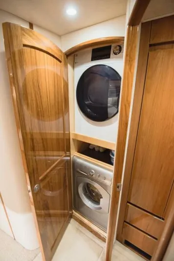 C Student Yacht Photos Pics Laundry area in 2017 Viking 66 Convertible yacht with stacked washer and dryer.
