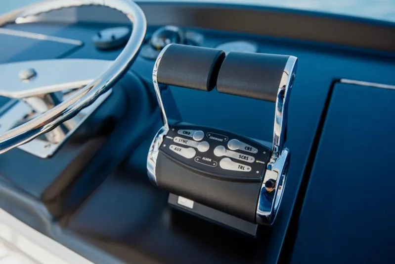 C Student Yacht Photos Pics Close-up of 2017 Viking 66 Convertible yacht controls and steering wheel.