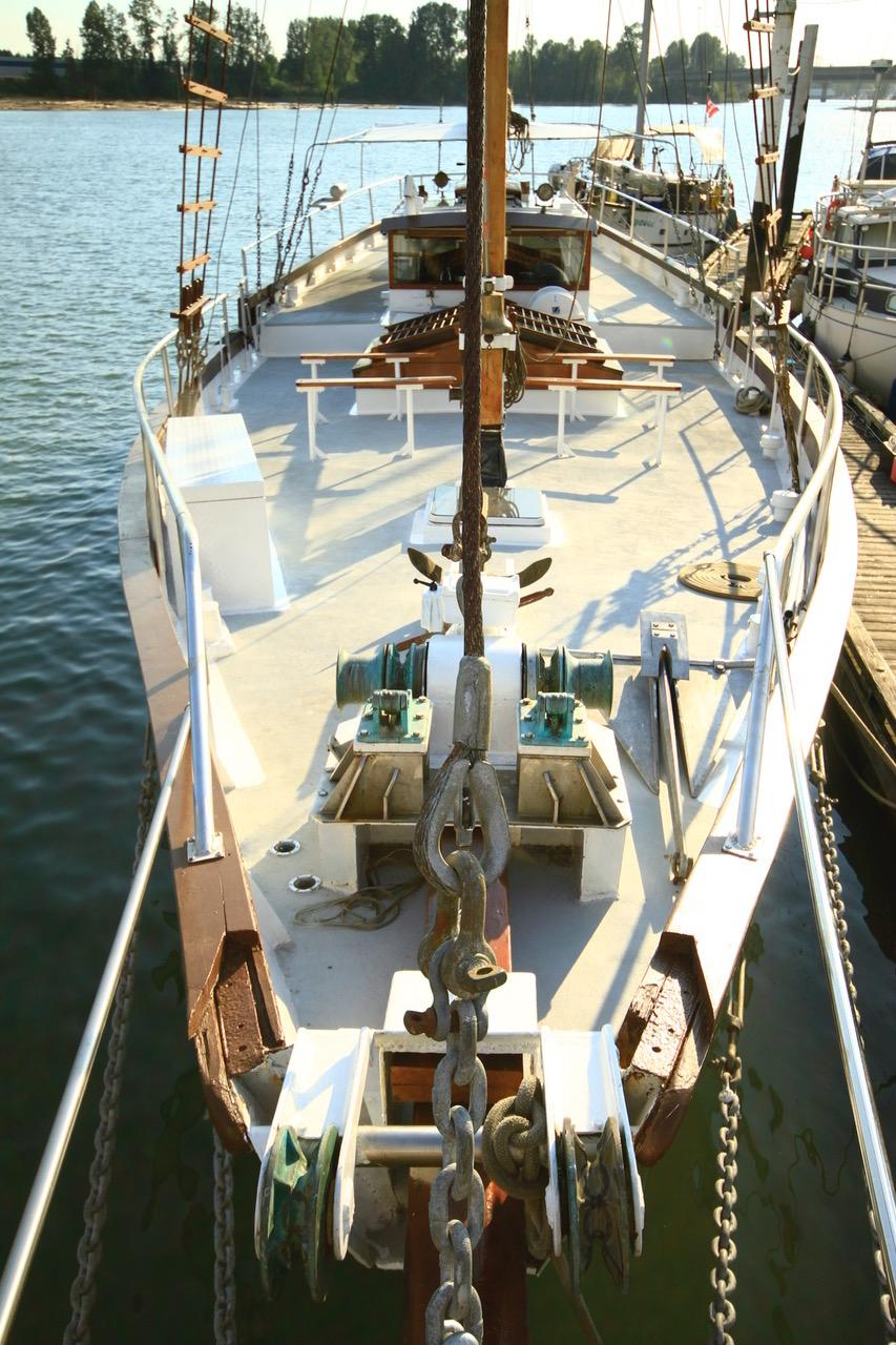 1975 Custom Staysail Schooner docked, showcasing deck and rigging details.