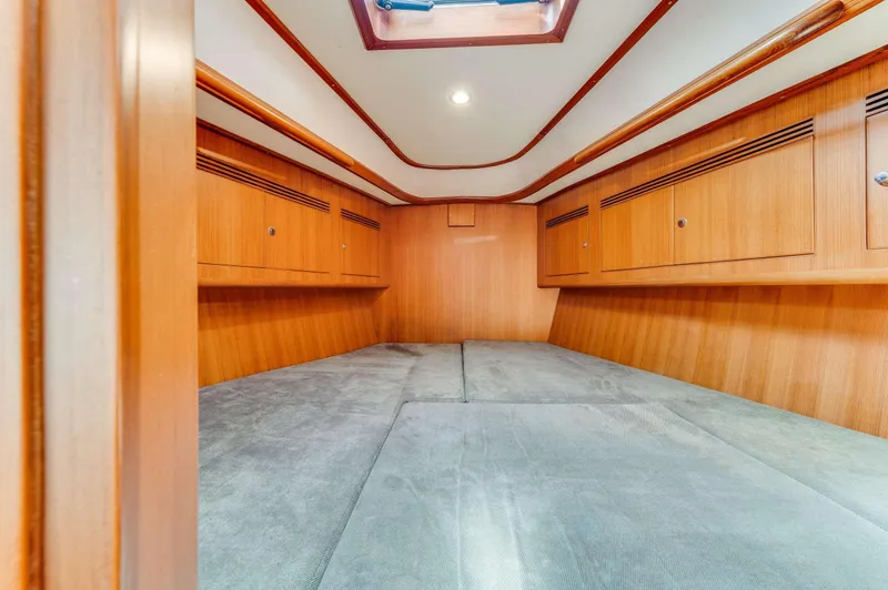 Liberte' Yacht Photos Pics Spacious interior cabin of 2011 Hylas 46 yacht with wooden finish.