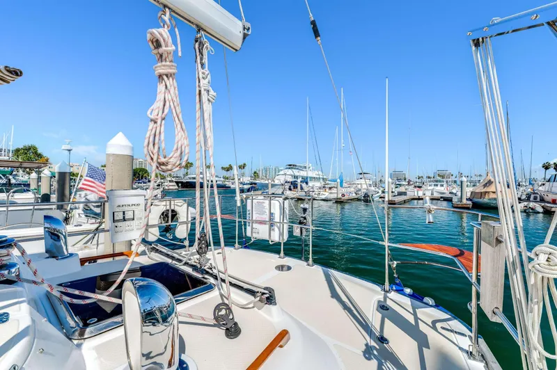 Liberte' Yacht Photos Pics Hylas 46 sailboat docked in marina, clear blue sky, 2011 model.
