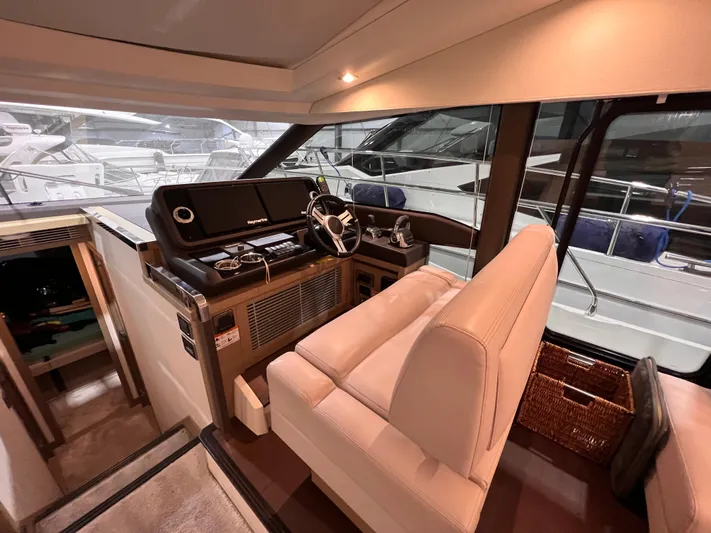  Yacht Photos Pics Luxurious 2018 Prestige 520S yacht helm with modern controls and plush seating.