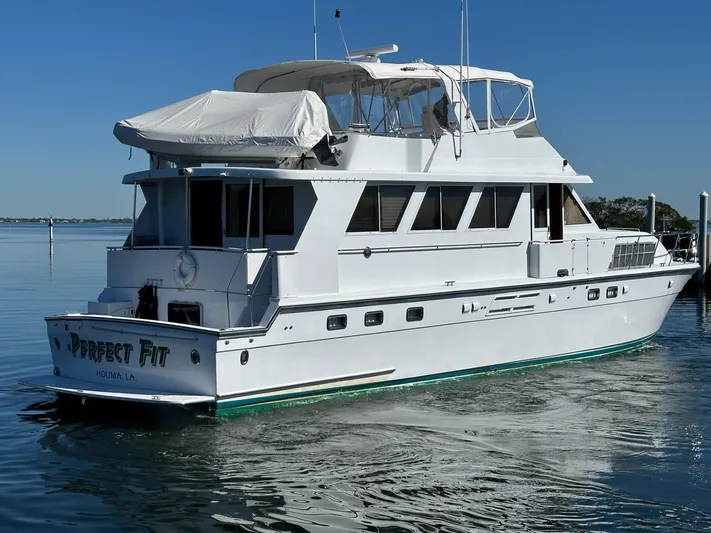 Perfect Fit Yacht Photos Pics Luxury Jefferson Marquessa 60 Cockpit yacht, 2000 model, cruising on calm waters.