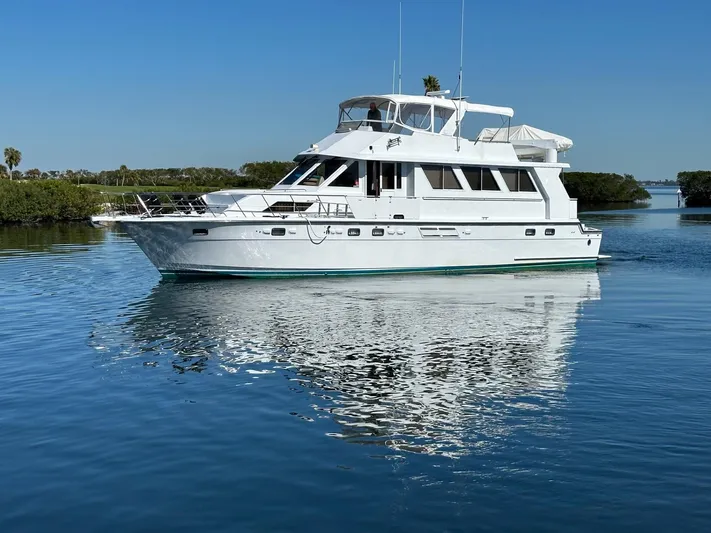 Perfect Fit Yacht Photos Pics Luxury Jefferson Marquessa 60 Cockpit yacht cruising on calm waters, 2000 model.