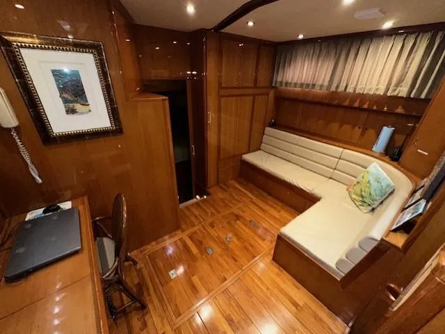 Perfect Fit Yacht Photos Pics Luxurious interior of 2000 Jefferson Marquessa 60 Cockpit yacht with wood paneling and seating area.