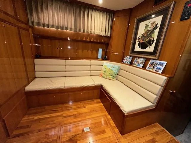 Perfect Fit Yacht Photos Pics Luxurious interior of 2000 Jefferson Marquessa 60 Cockpit yacht with wood paneling and cozy seating.
