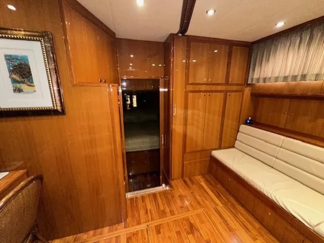 Perfect Fit Yacht Photos Pics Luxurious interior of 2000 Jefferson Marquessa 60 Cockpit yacht with wood paneling and seating.